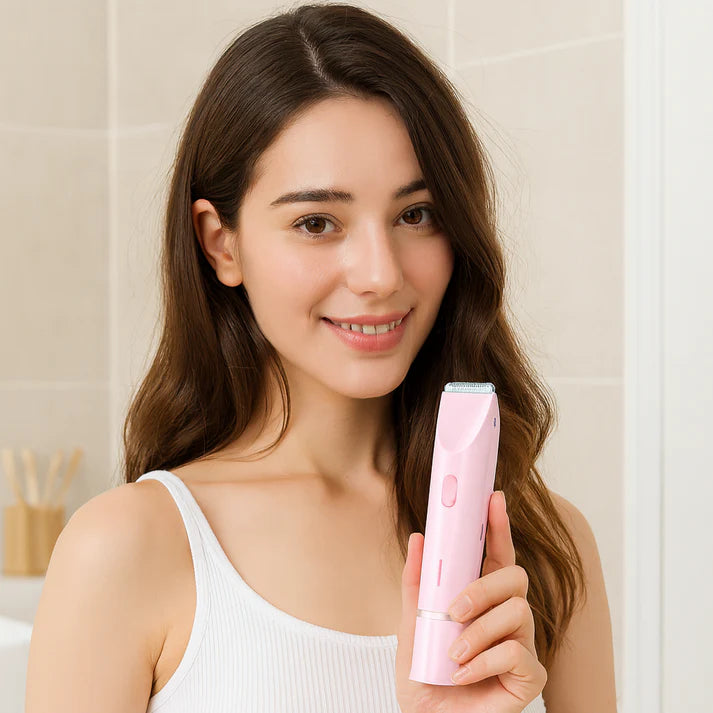 Woman holding a dual head bikini trimmer for women in a bright bathroom setting, showcasing its sleek design.